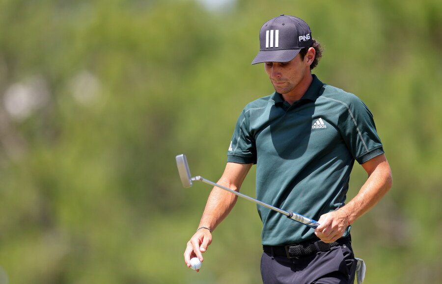 Joaquin Niemann walks on the course during a LIV event