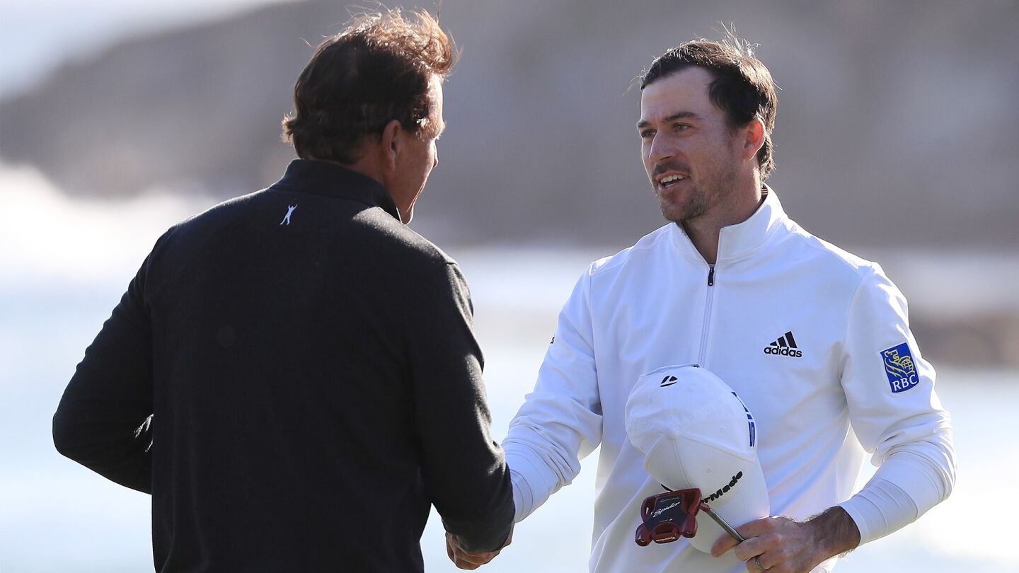 mickelson_taylor_1920_pebble20_d4_handshake.jpg